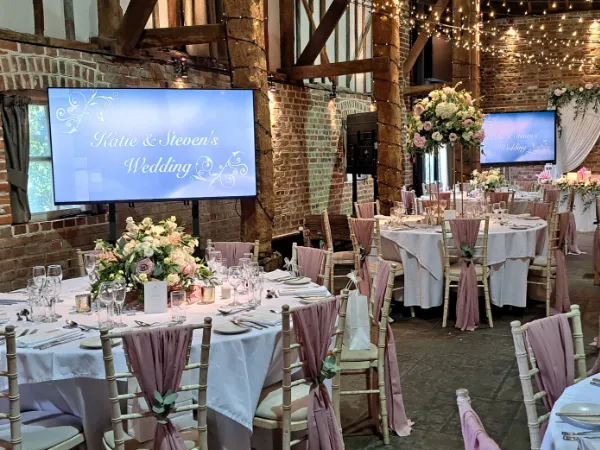 Video screens at a wedding